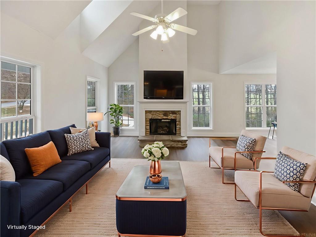 185 Thrasher Lane Jasper, GA 30143 - Photo 4 of 32 a living room with furniture a flat screen tv and a fireplace