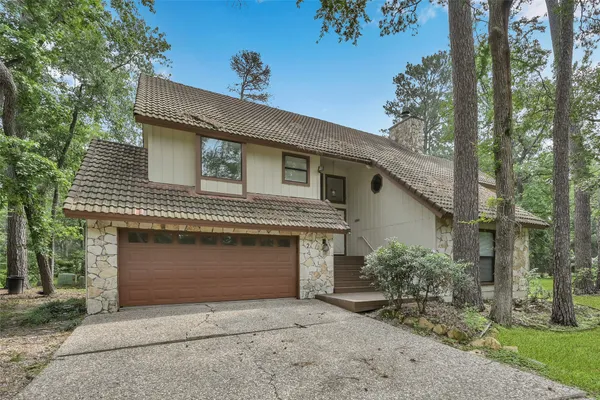 a front view of a house with a garage