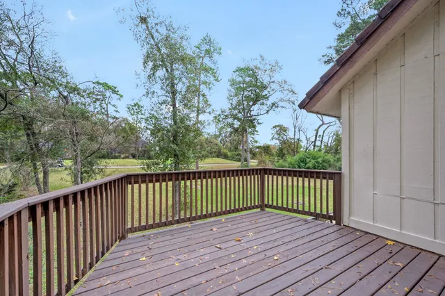 a view of deck with wooden floor and seating space