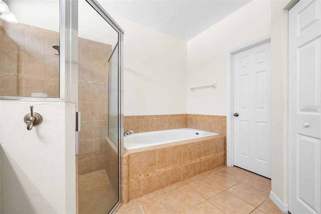 7638 Southwest 80th Drive Gainesville, FL 32608 - Photo 27 of 48 a bathroom with a bathtub and shower