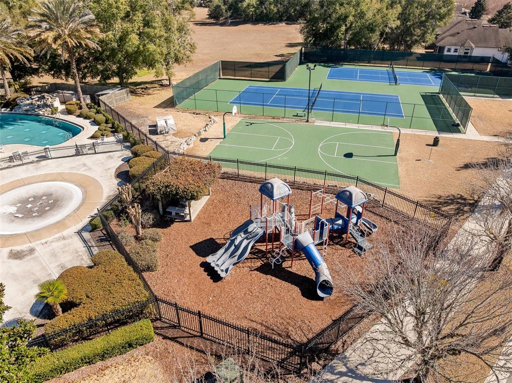 7638 Southwest 80th Drive Gainesville, FL 32608 - Photo 42 of 48 an aerial view of a chairs and table on the patio