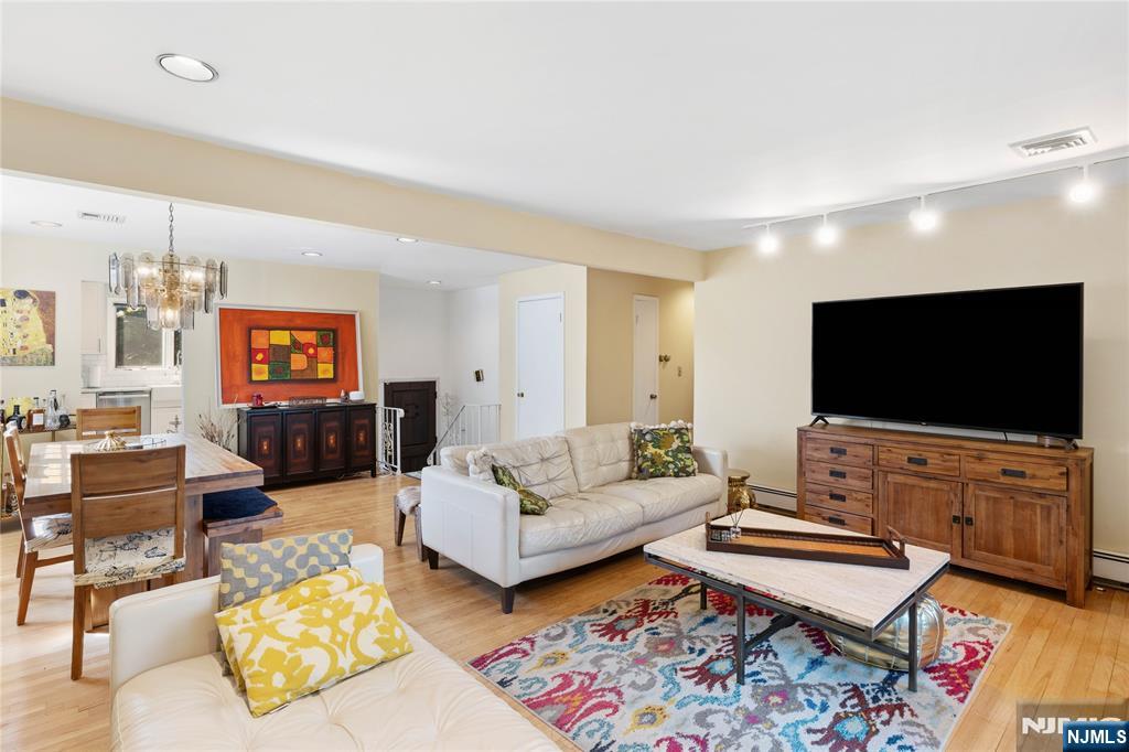 1675 Broad Street Bloomfield, NJ 07003 - Photo 2 of 35 a living room with furniture and a flat screen tv