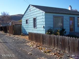306 Yakima Street Union Gap, WA 98903 - Photo 2 of 5 a front view of house with small yard
