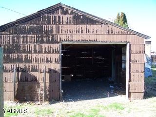 306 Yakima Street Union Gap, WA 98903 - Photo 4 of 5 a large building with a small yard