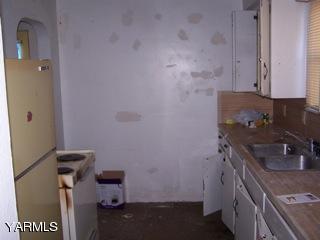 306 Yakima Street Union Gap, WA 98903 - Photo 5 of 5 a bathroom with a sink toilet and vanity