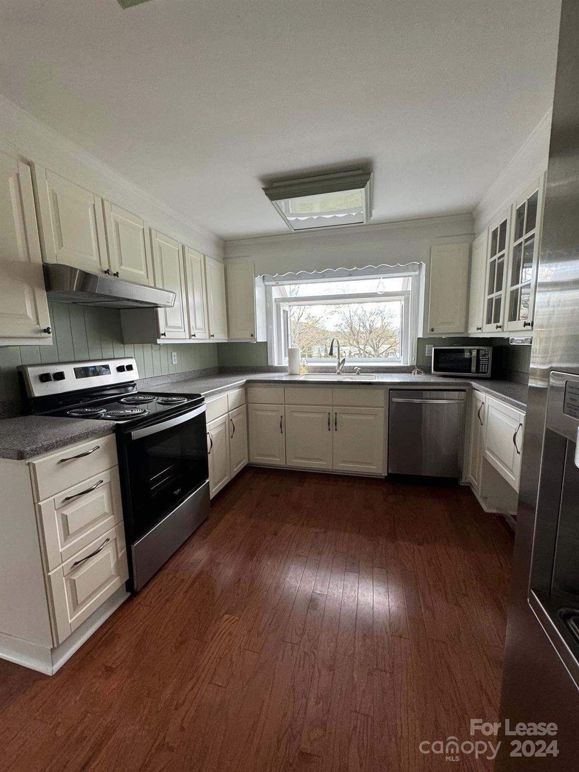 2793 Highway 268 Lenoir, NC 28645 - Photo 13 of 29 a kitchen with stainless steel appliances granite countertop a stove a sink dishwasher and a refrigerator