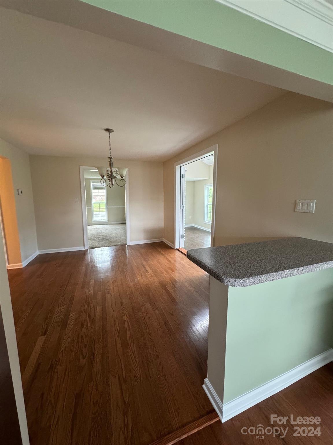 2793 Highway 268 Lenoir, NC 28645 - Photo 14 of 29 wooden floor in an empty room with a window