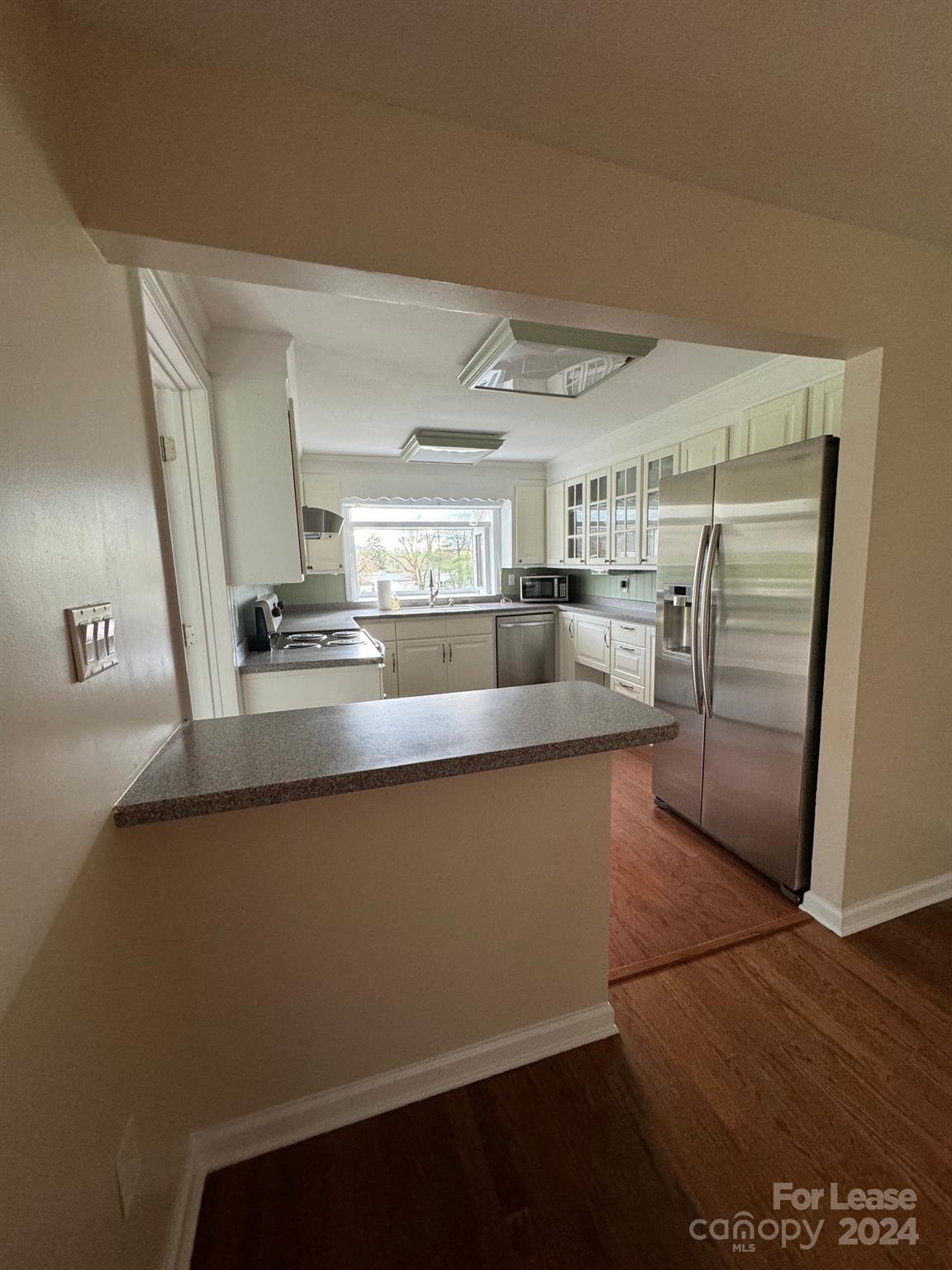 2793 Highway 268 Lenoir, NC 28645 - Photo 15 of 29 a kitchen with granite countertop a refrigerator and a sink
