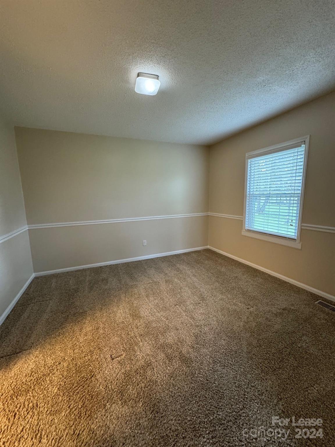 2793 Highway 268 Lenoir, NC 28645 - Photo 5 of 29 en empty room with windows