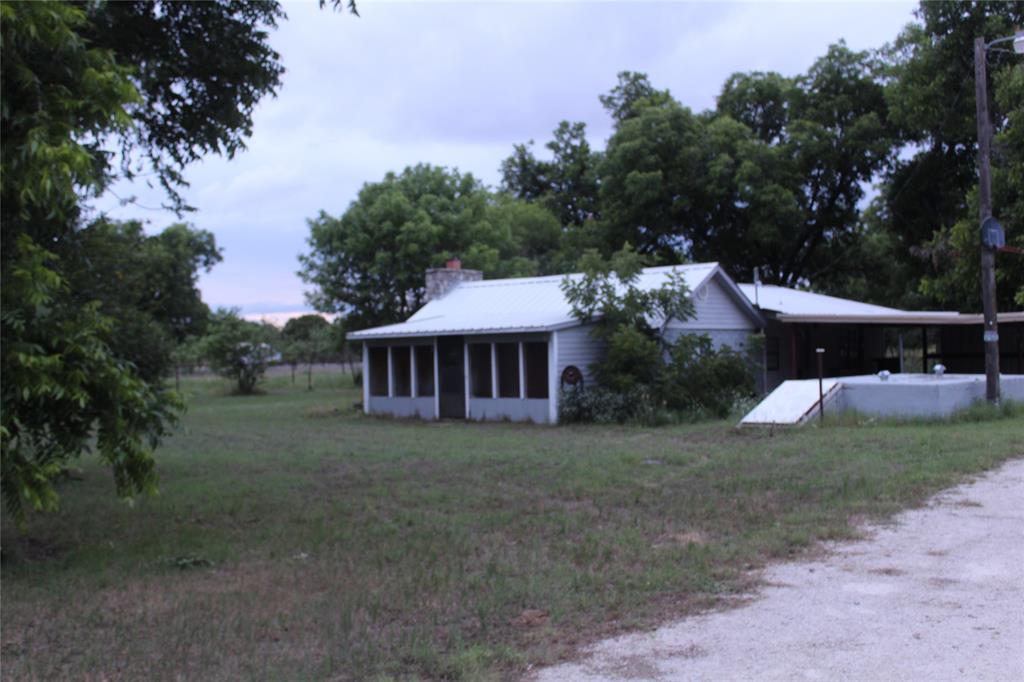 510 Hamby Road Clyde, TX 79510 - Photo 5 of 23 Side of farmhouse with view of storm cellar.