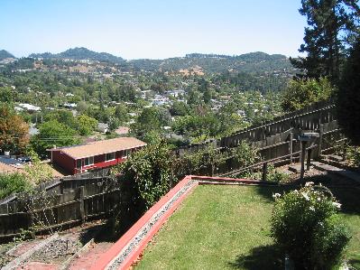 1339 Las Raposas Road San Rafael, CA 94903 - Photo 1 of 7 a view of a swimming pool with a yard and mountain view