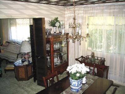1339 Las Raposas Road San Rafael, CA 94903 - Photo 3 of 7 a dining room with furniture a potted plant and a large window