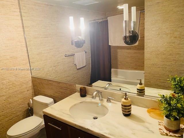 50 Biscayne Boulevard, Unit 709 Miami, FL 33132 - Photo 4 of 18 a bathroom with a sink and a mirror