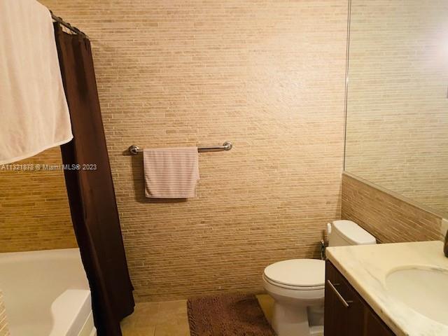 50 Biscayne Boulevard, Unit 709 Miami, FL 33132 - Photo 5 of 18 a bathroom with a toilet and a sink