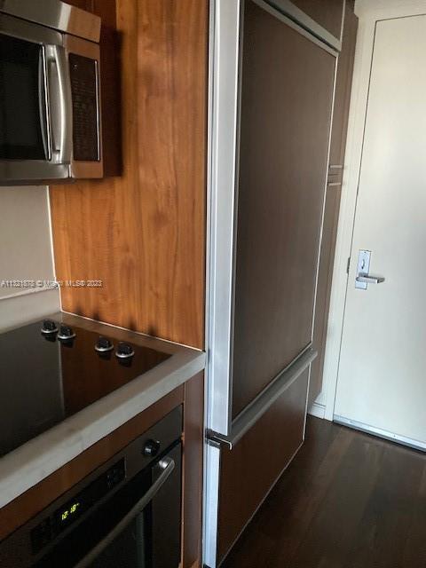 50 Biscayne Boulevard, Unit 709 Miami, FL 33132 - Photo 8 of 18 a close view of under a microwave oven