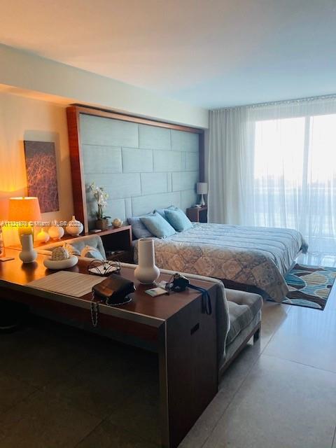 50 Biscayne Boulevard, Unit 709 Miami, FL 33132 - Photo 9 of 18 a bedroom with bed and window