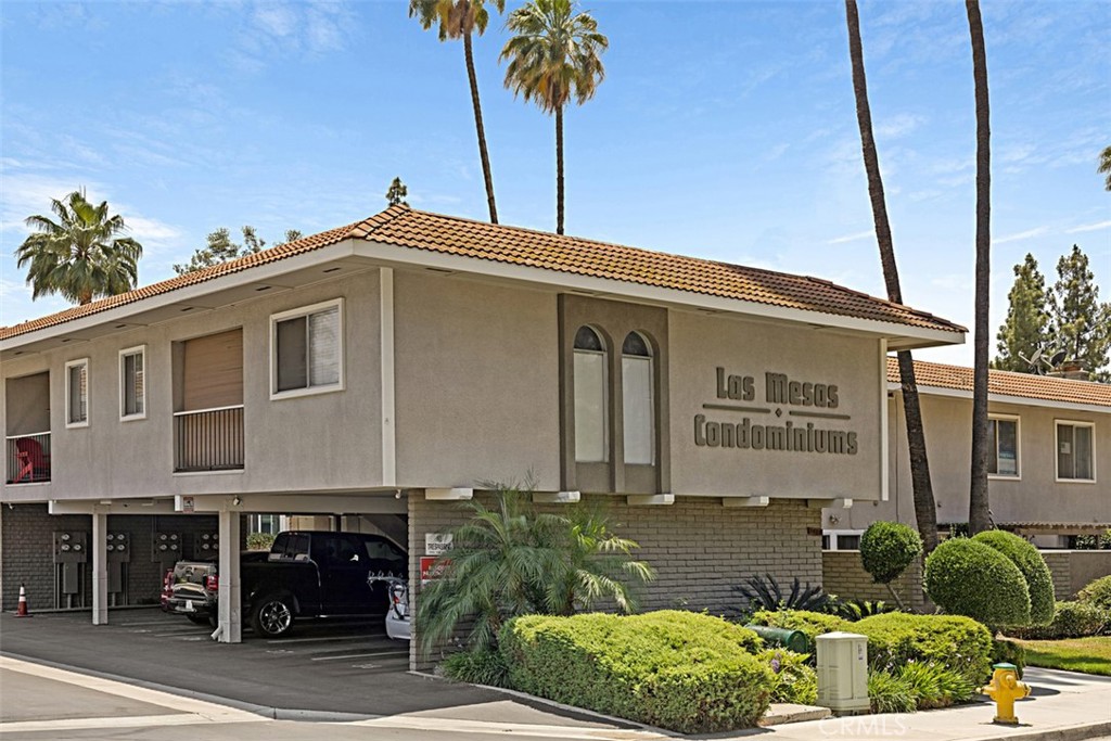 1040 Central Avenue, Unit 10 Riverside, CA 92507 - Photo 1 of 1 a front view of a house with garden