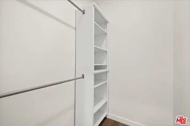 a view of an empty walk in closet