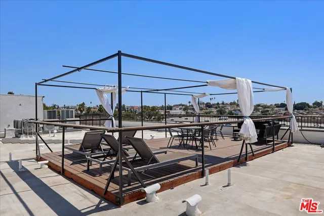 a view of a chairs and table in the patio