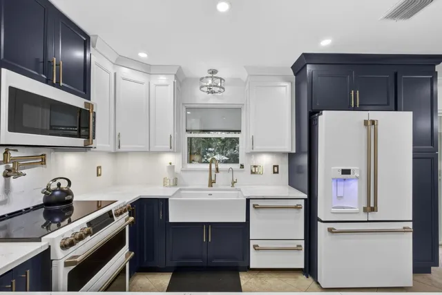 a bedroom with a bed and a dresser with wooden floor