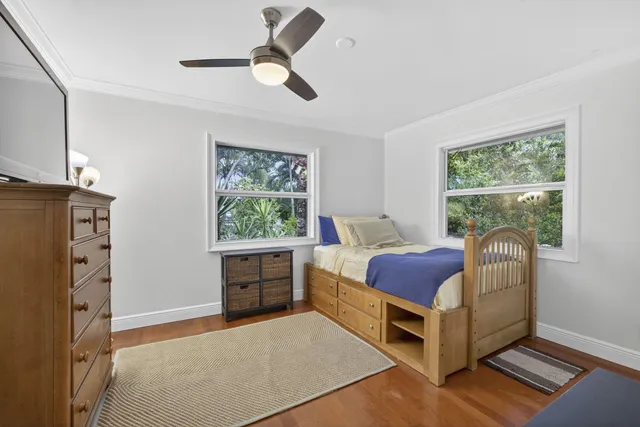 a view of house with garden space and swimming pool
