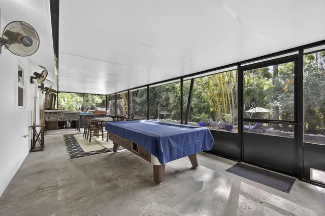 a front view of a house with a yard and fountain