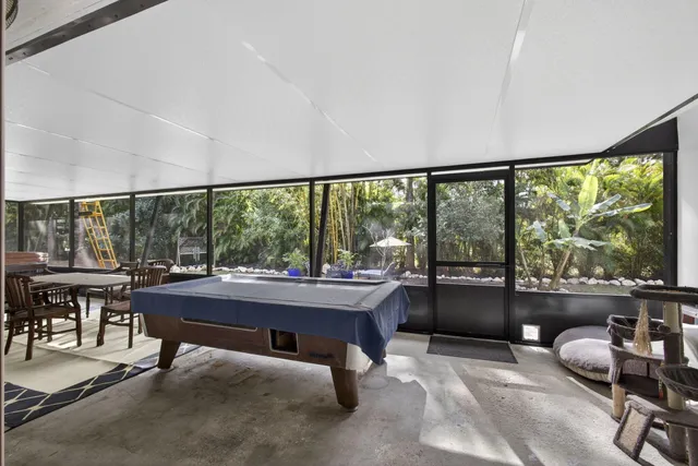 a front view of a house with a yard table and chairs