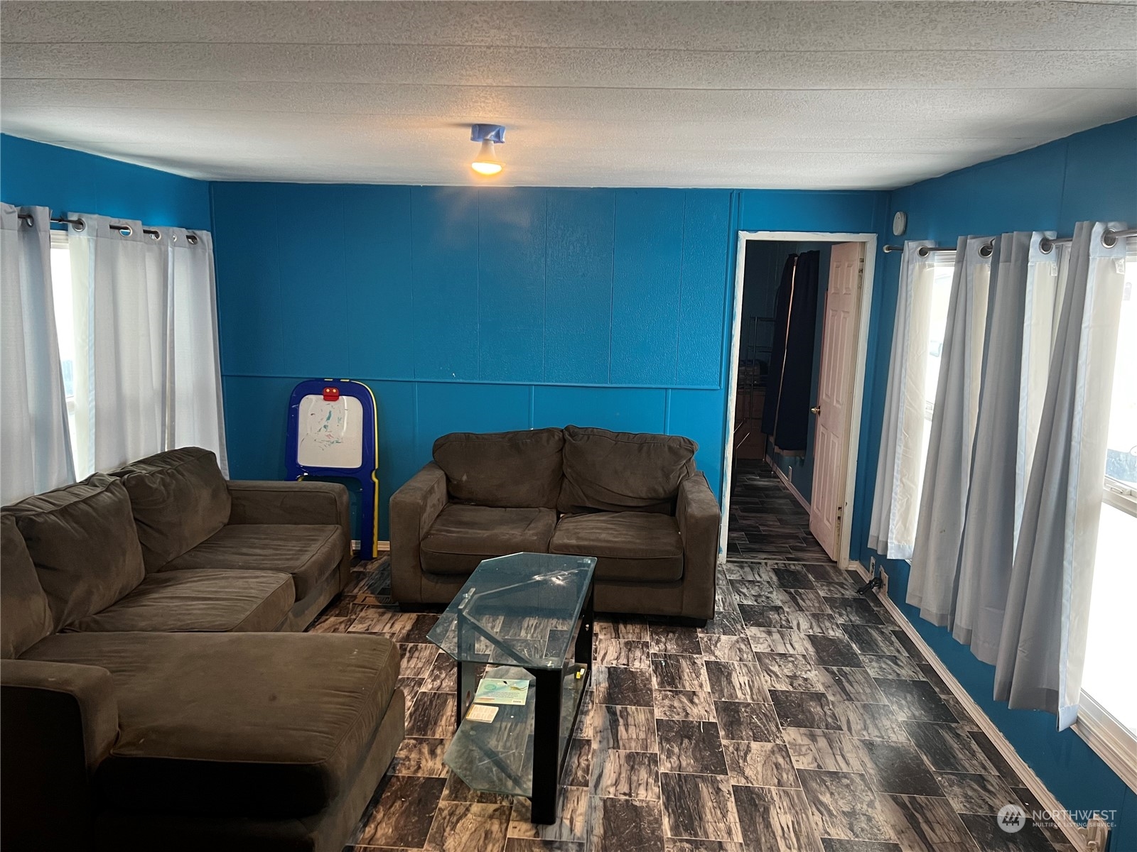 1331 West Pine Street, Unit 34 Walla Walla, WA 99362 - Photo 3 of 10 a living room with furniture and a rug