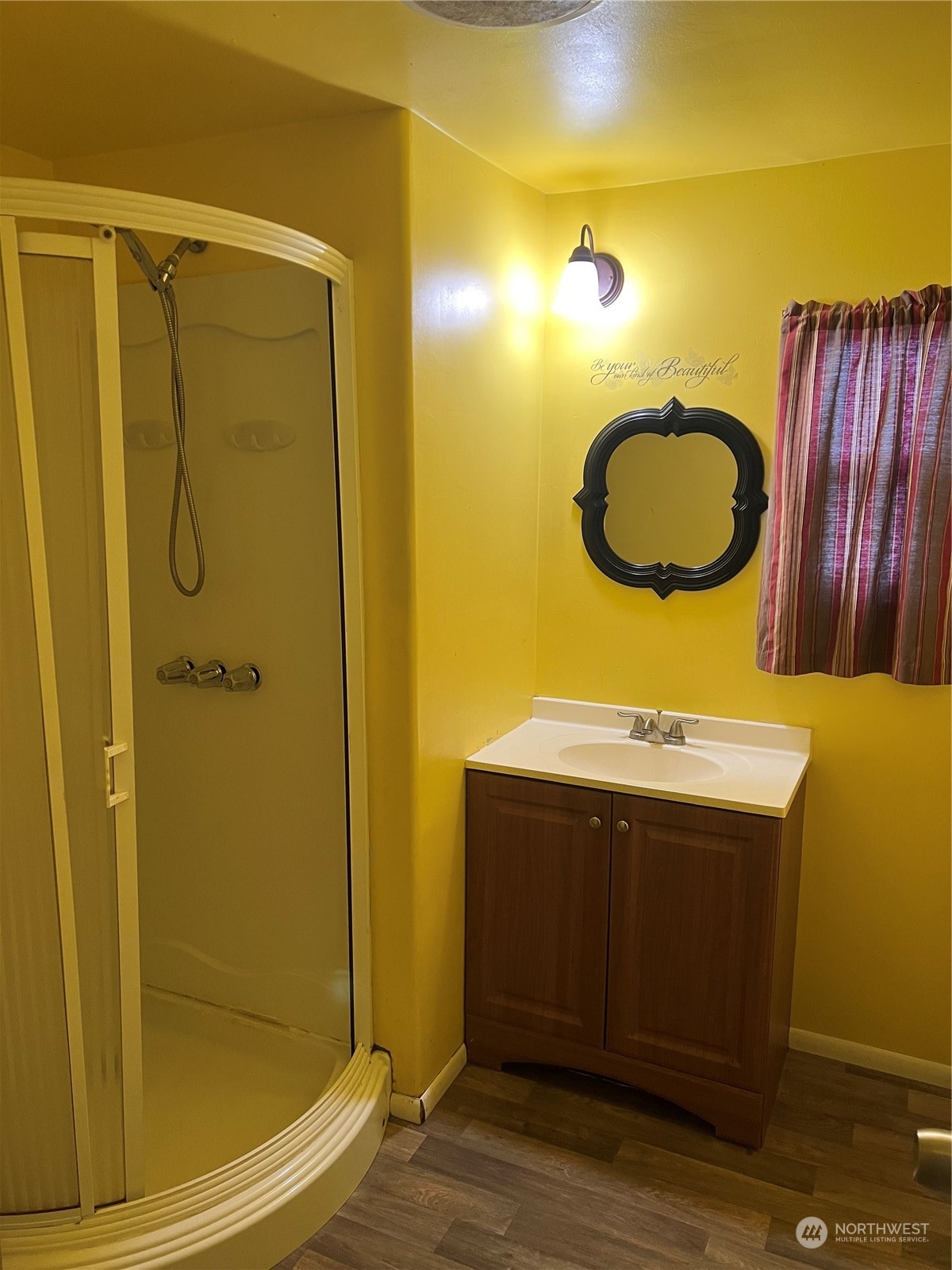 1331 West Pine Street, Unit 34 Walla Walla, WA 99362 - Photo 8 of 10 a bathroom with a sink mirror and shower