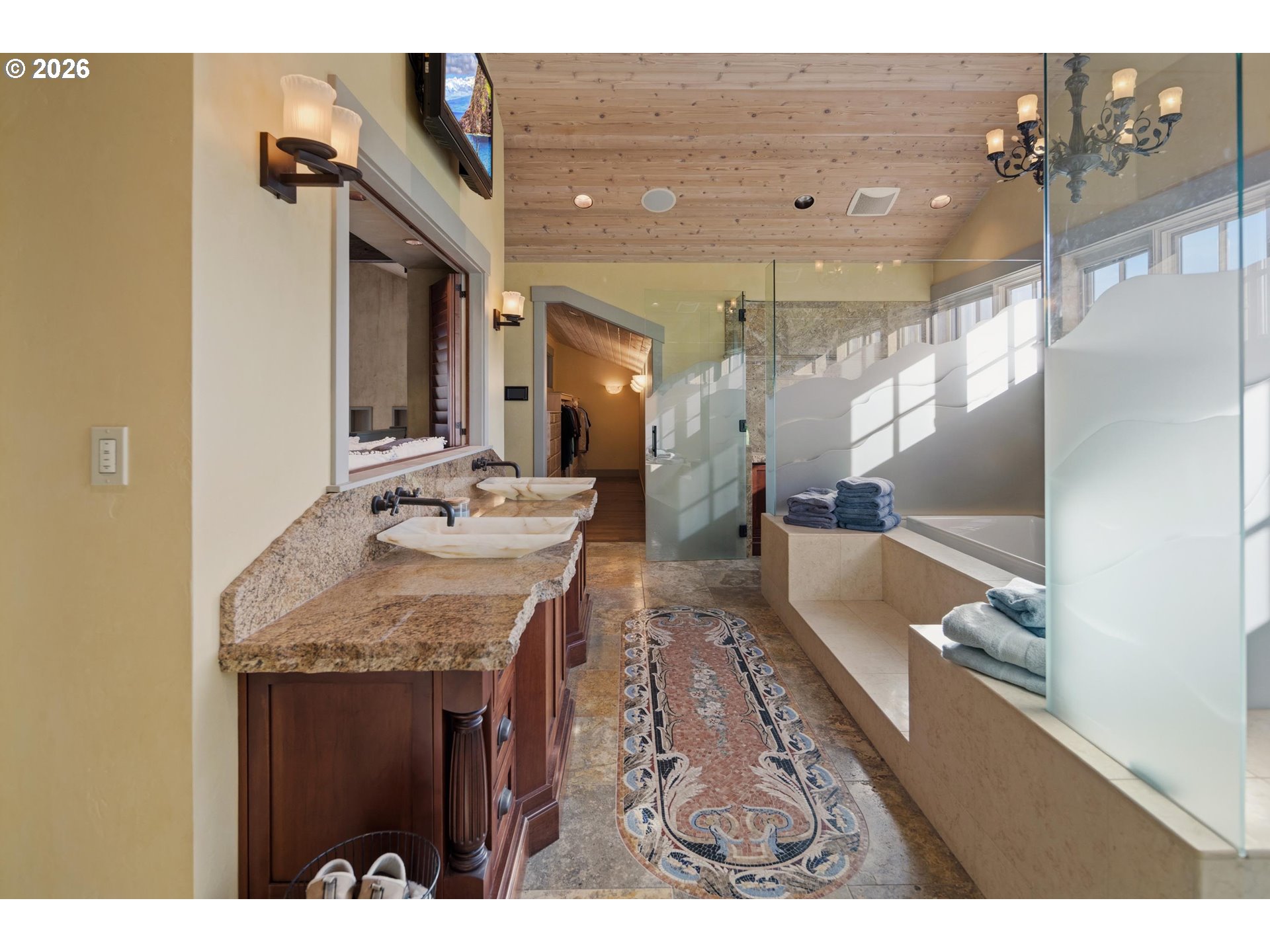 545 McAdams Road East Longview, WA 98632 - Photo 33 of 46 a bathroom with a sink a large mirror and a shower