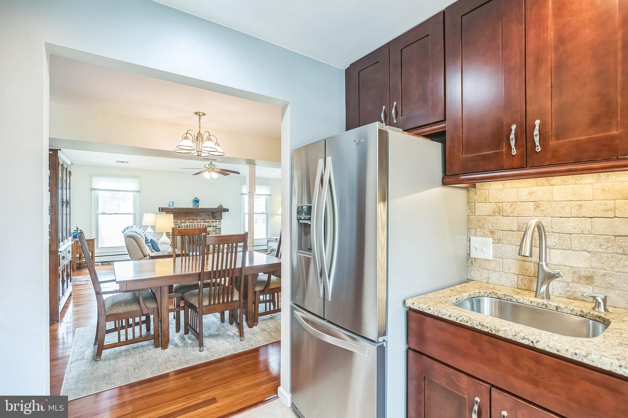 45 Dover Road Westampton, NJ 08060 - Photo 15 of 38 a kitchen with granite countertop a refrigerator and a sink