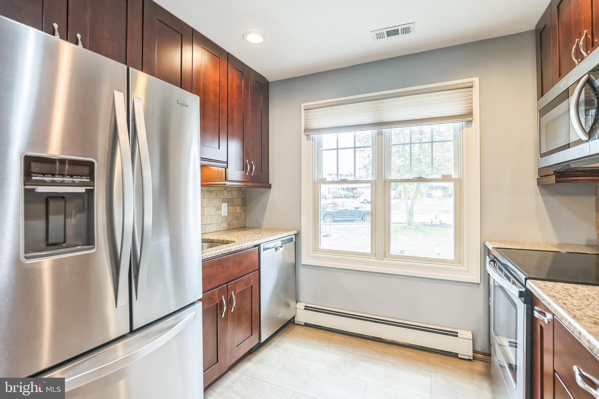 45 Dover Road Westampton, NJ 08060 - Photo 17 of 38 a kitchen with stainless steel appliances granite countertop a refrigerator and a stove