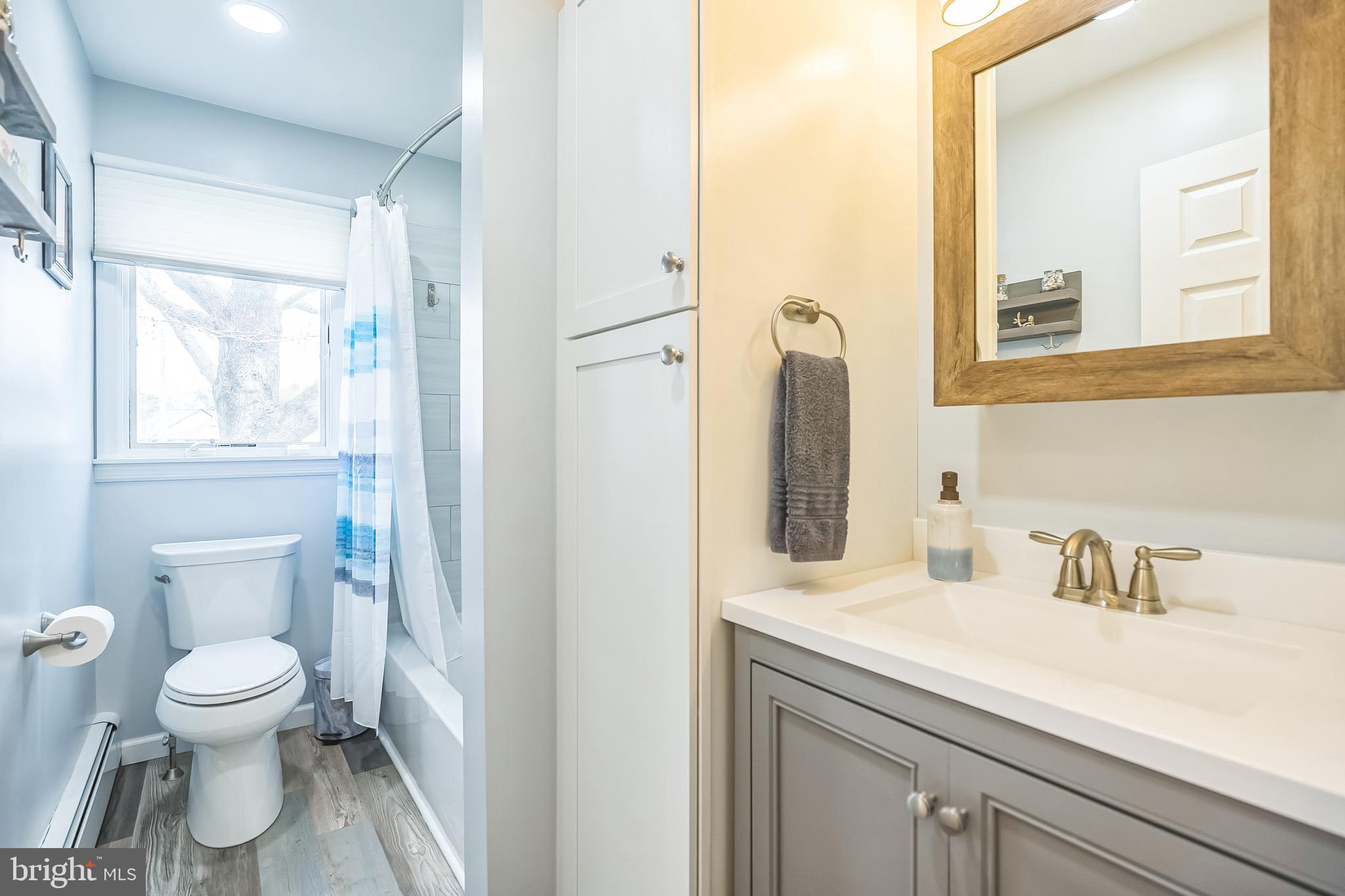45 Dover Road Westampton, NJ 08060 - Photo 20 of 38 a bathroom with a sink a toilet and a mirror