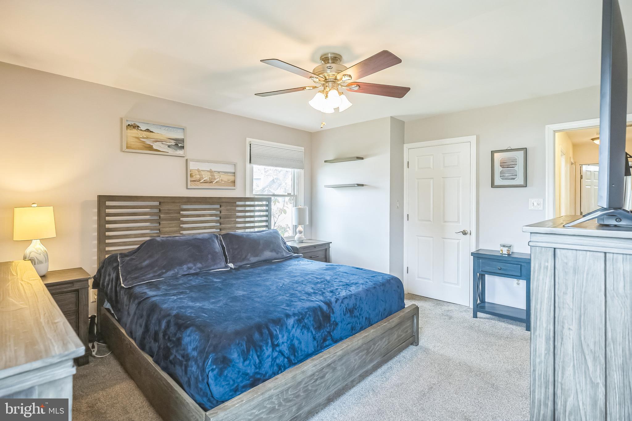 45 Dover Road Westampton, NJ 08060 - Photo 23 of 38 a bedroom with a large bed and a chandelier