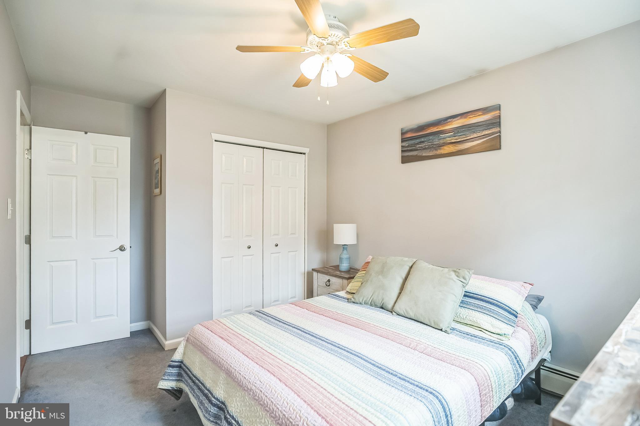 45 Dover Road Westampton, NJ 08060 - Photo 26 of 38 a bedroom with a bed and a chandelier