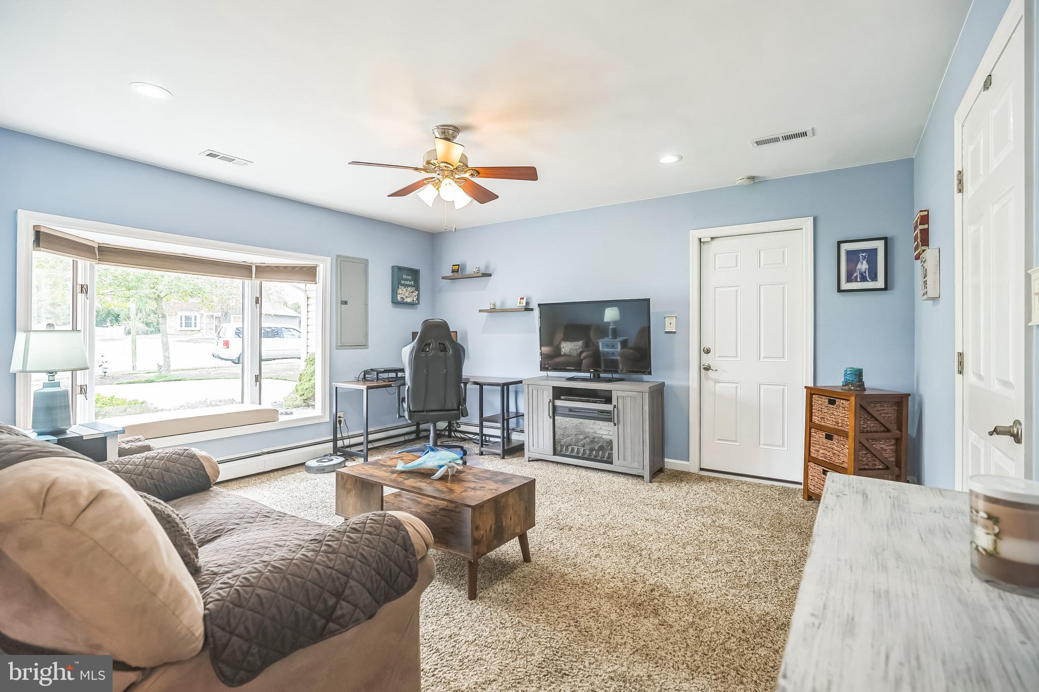 45 Dover Road Westampton, NJ 08060 - Photo 29 of 38 a living room with furniture and a flat screen tv
