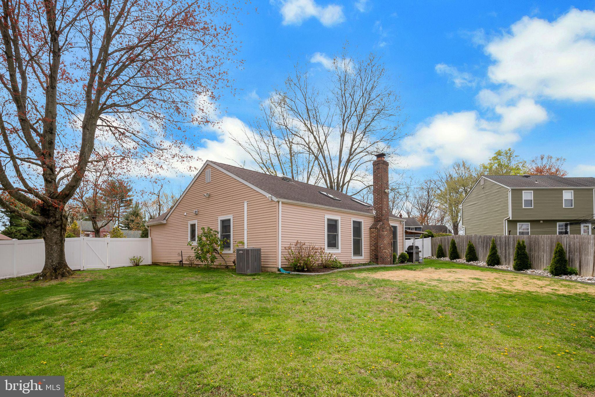 45 Dover Road Westampton, NJ 08060 - Photo 34 of 38 a view of a white house with a big yard and large trees