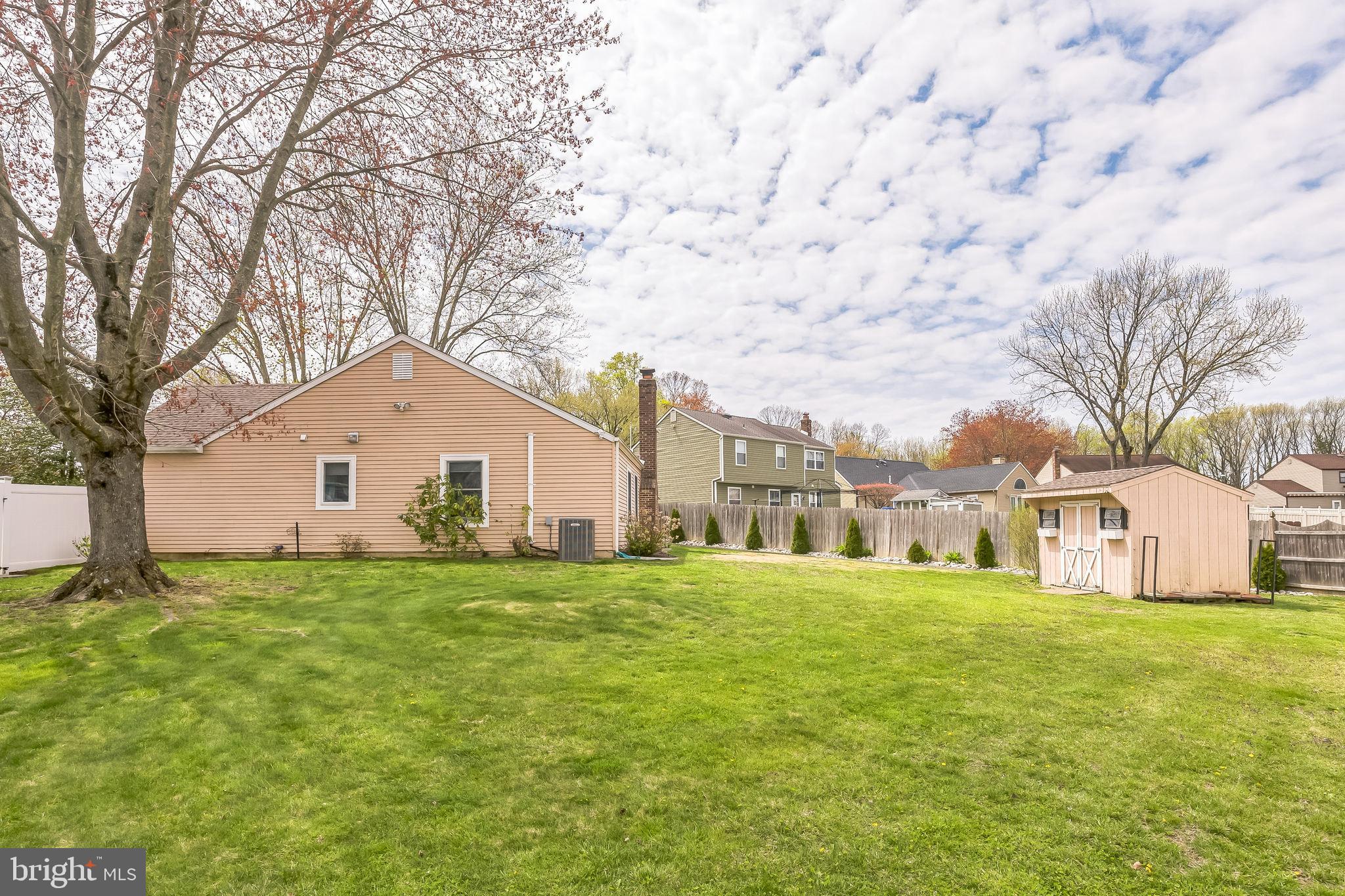 45 Dover Road Westampton, NJ 08060 - Photo 37 of 38 a large house with a big yard and large trees