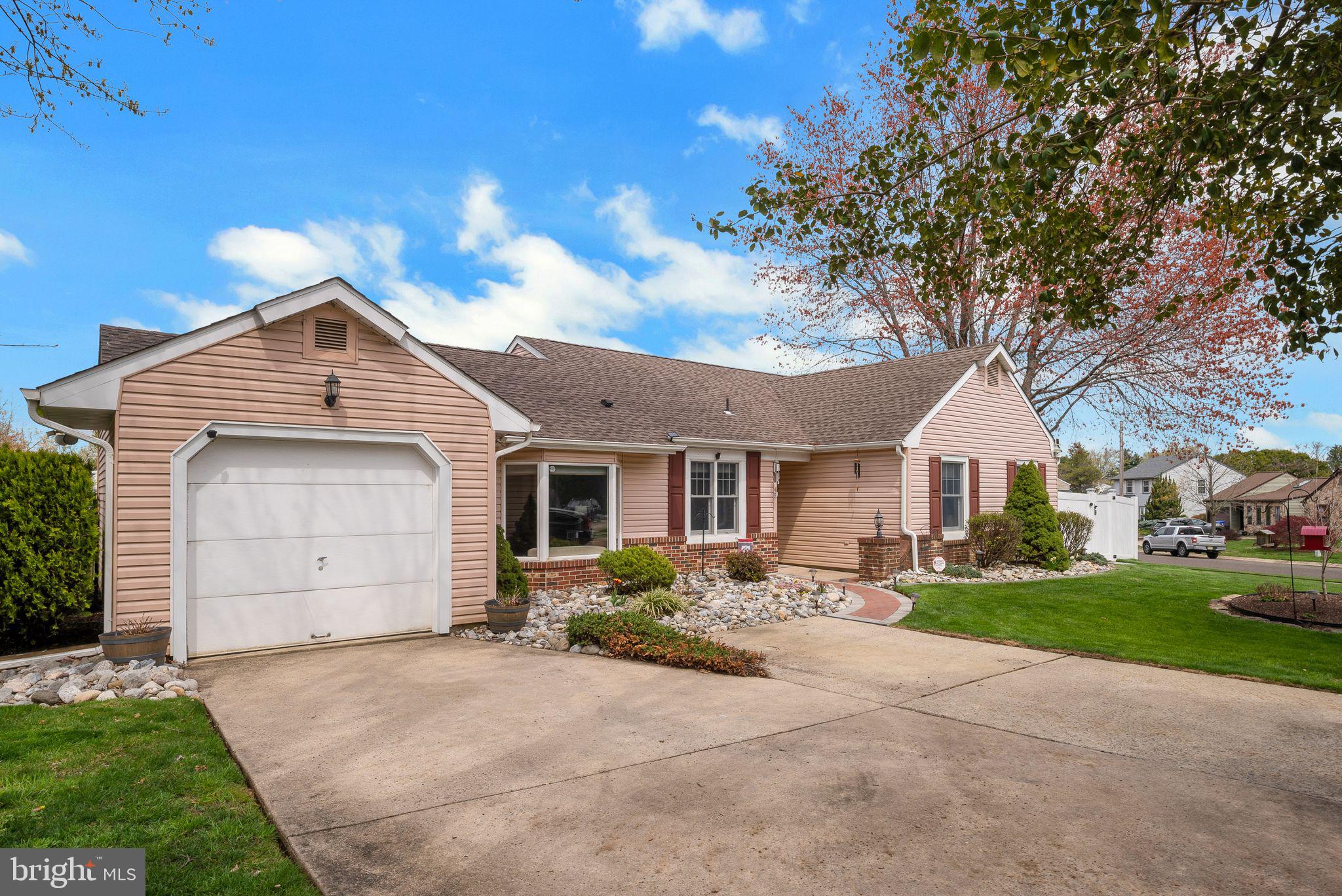 45 Dover Road Westampton, NJ 08060 - Photo 4 of 38 a front view of a house with a yard and garage