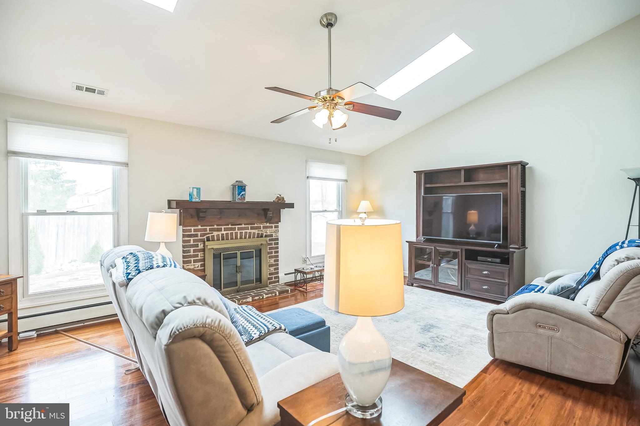 45 Dover Road Westampton, NJ 08060 - Photo 6 of 38 a living room with furniture a fireplace and a flat screen tv