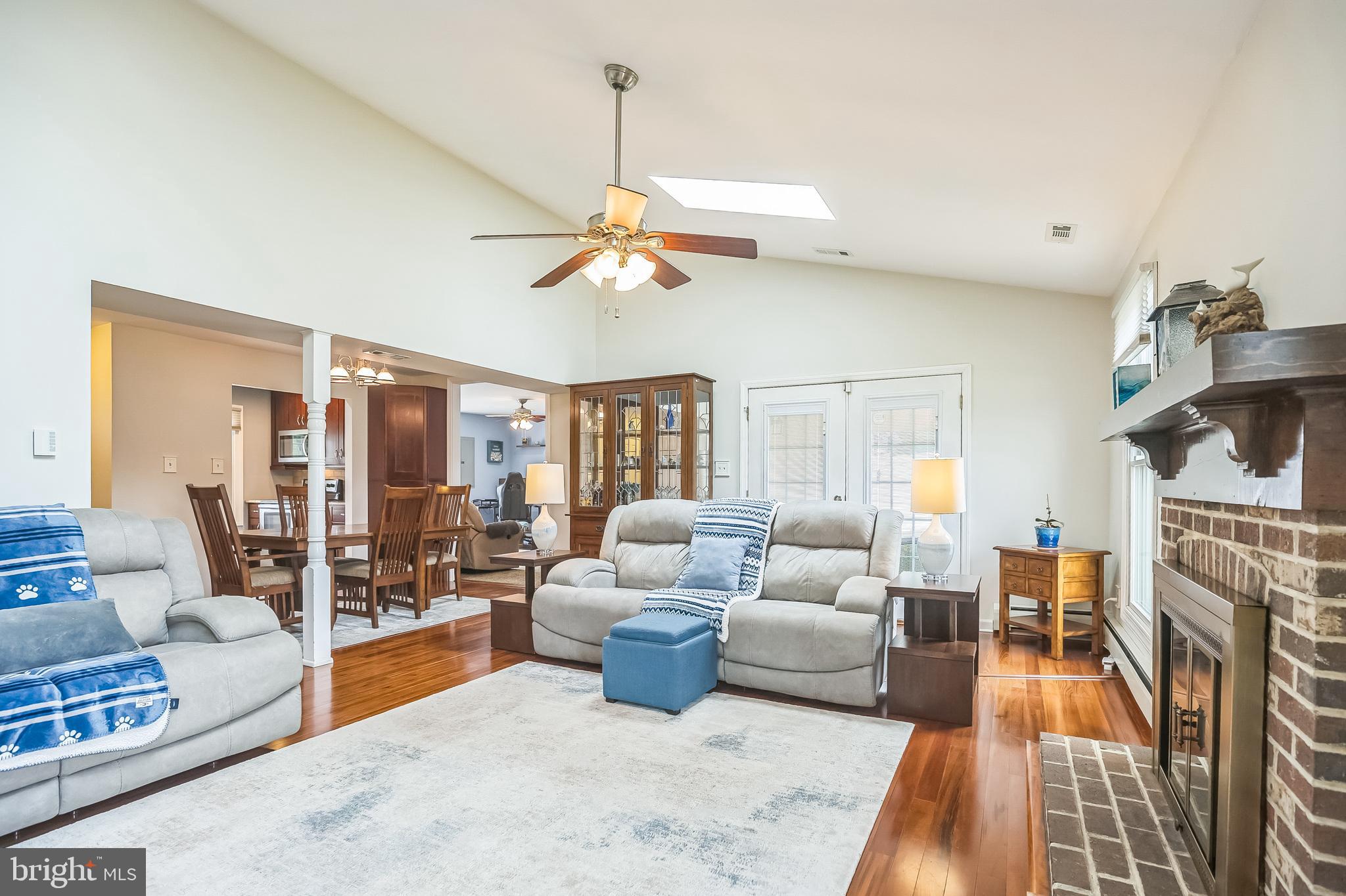 45 Dover Road Westampton, NJ 08060 - Photo 8 of 38 a living room with furniture a fireplace and a chandelier