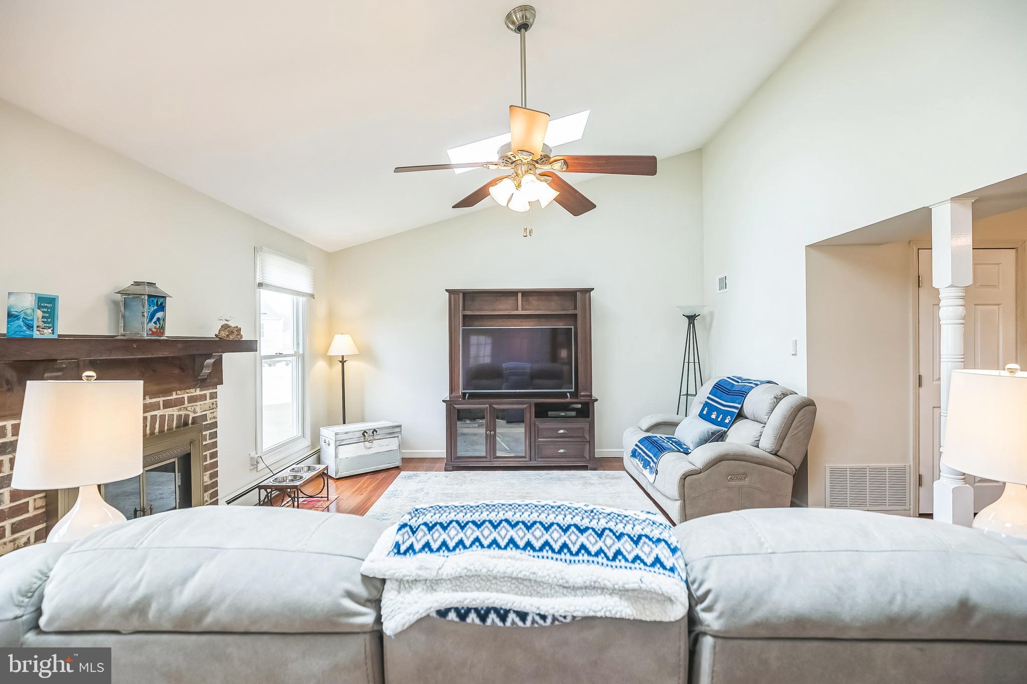 45 Dover Road Westampton, NJ 08060 - Photo 10 of 38 a living room with furniture a fireplace and a window