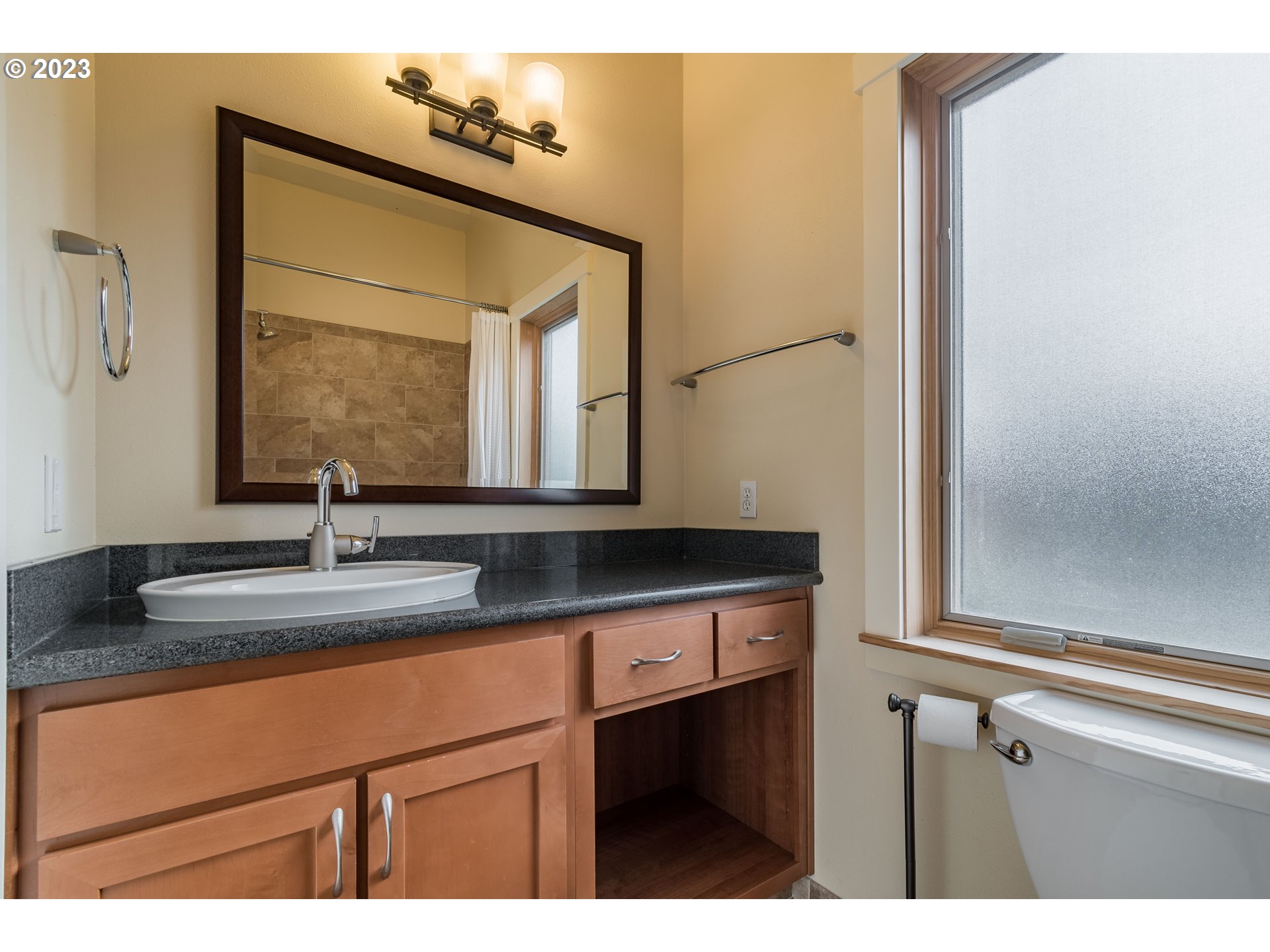 1410 Perdue Loop Eugene, OR 97401 - Photo 22 of 32 a bathroom with a sink and a mirror