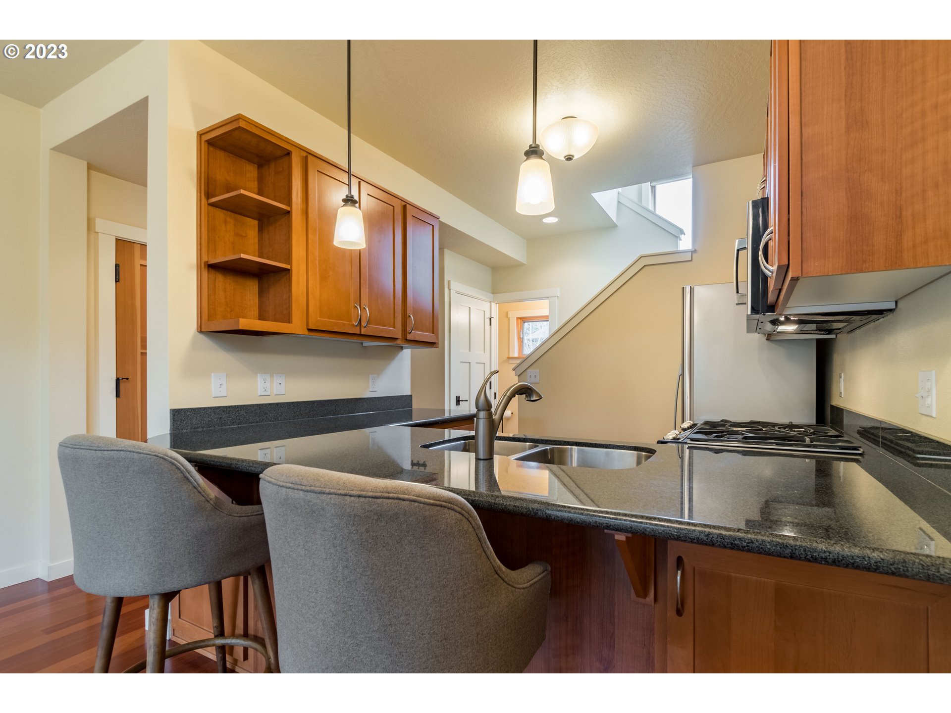 1410 Perdue Loop Eugene, OR 97401 - Photo 7 of 32 a kitchen with a table chairs and cabinets