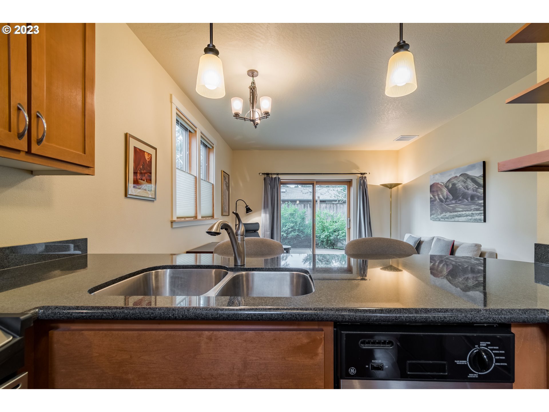 1410 Perdue Loop Eugene, OR 97401 - Photo 9 of 32 a kitchen with a sink a window and cabinets