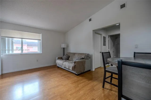 a living room with furniture and a window