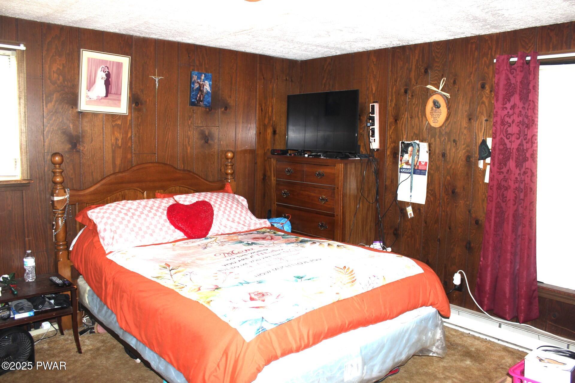 30 Brookfield Road, Unit LOT 1259 Lake Ariel, PA 18436 - Photo 9 of 32 a bed room with a bed and a television