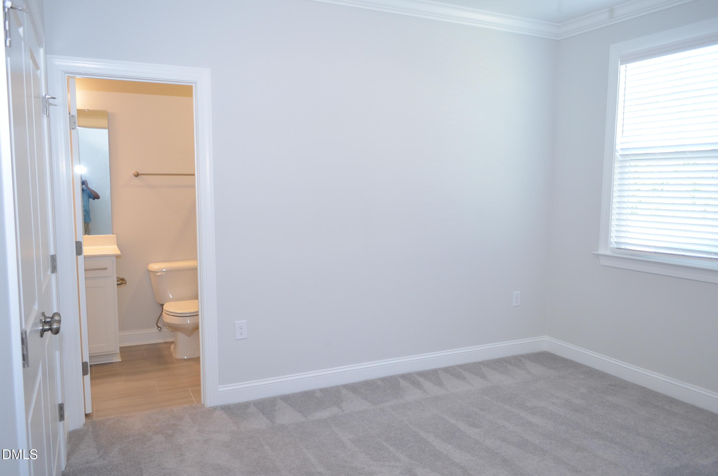 268 Edge Of Auburn Boulevard Raleigh, NC 27610 - Photo 16 of 36 an empty room and a bathroom with a toilet