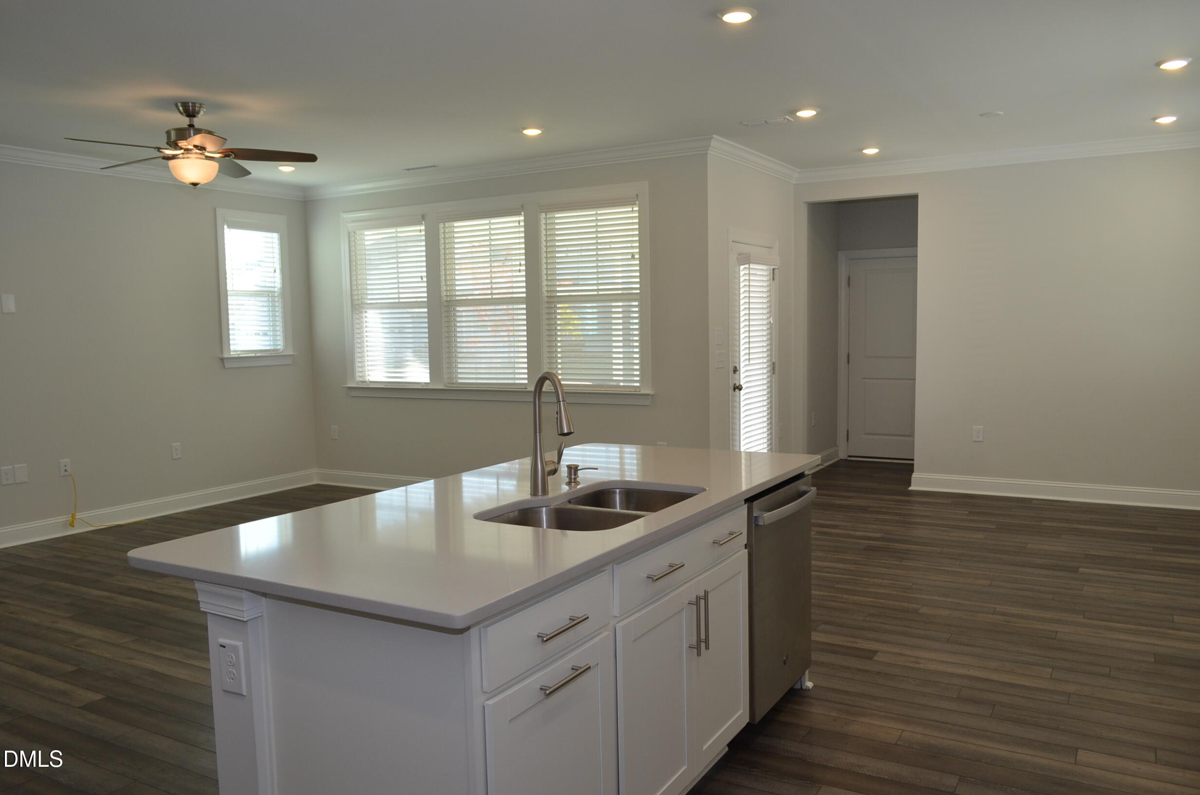 268 Edge Of Auburn Boulevard Raleigh, NC 27610 - Photo 18 of 36 a kitchen with a sink and cabinets