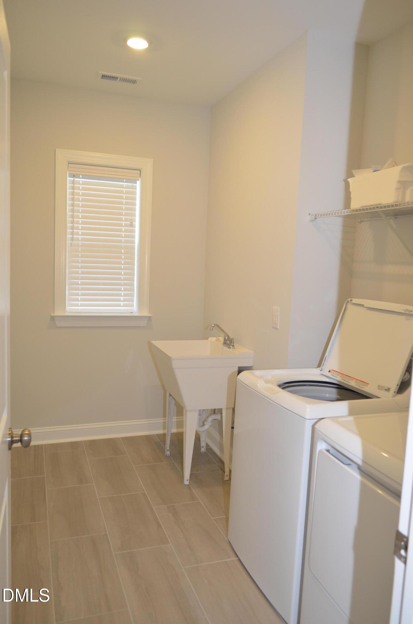 268 Edge Of Auburn Boulevard Raleigh, NC 27610 - Photo 25 of 36 a utility room with dryer and washer
